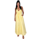 Woman wearing a yellow dress on a white background