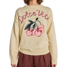 Beige sweater with 'Dolce Vita' and cherry design on a white background