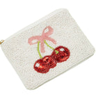 Beaded pouch with cherry design on a white background