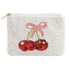 Pouch with embroidered cherries and a bow on a white background