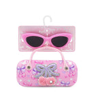 Pink sunglasses with decorative case on a white background