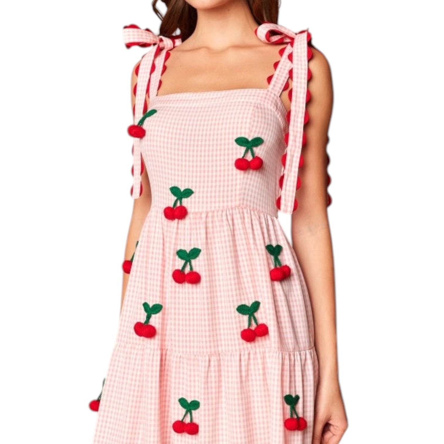 Pink checkered dress with cherry designs on a white background
