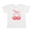 White t-shirt with cherries and a pink bow design on a white background