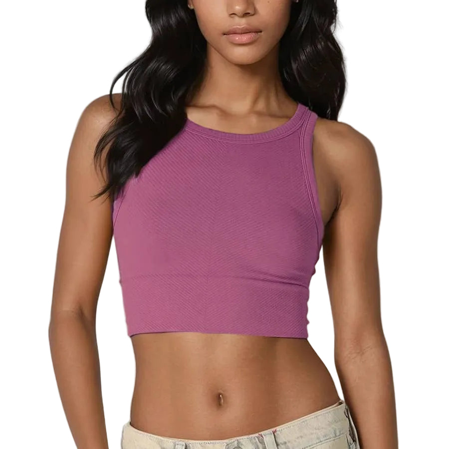 Woman wearing a purple crop top on a white background