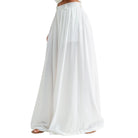 White wide-leg pants worn by a person on a white background