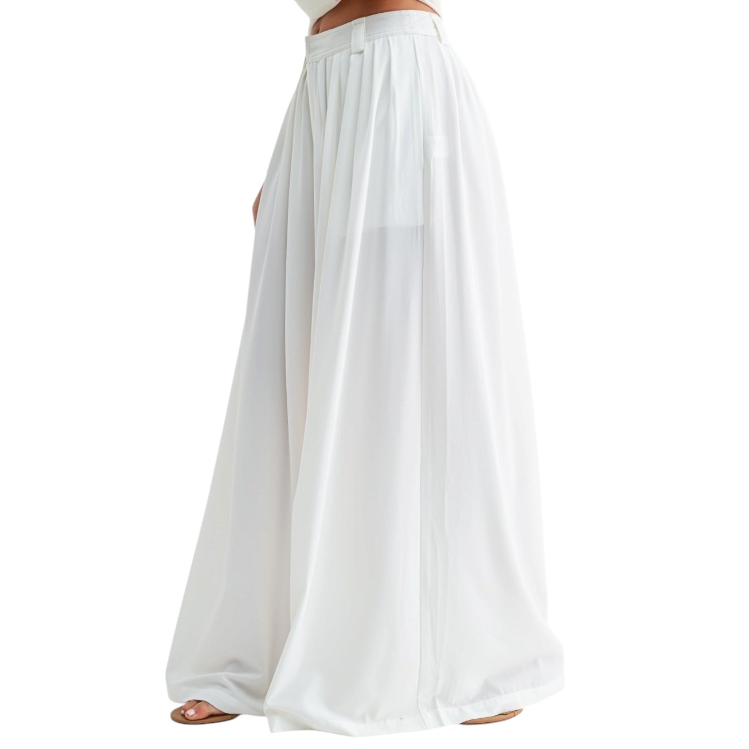 White wide-leg pants worn by a person on a white background