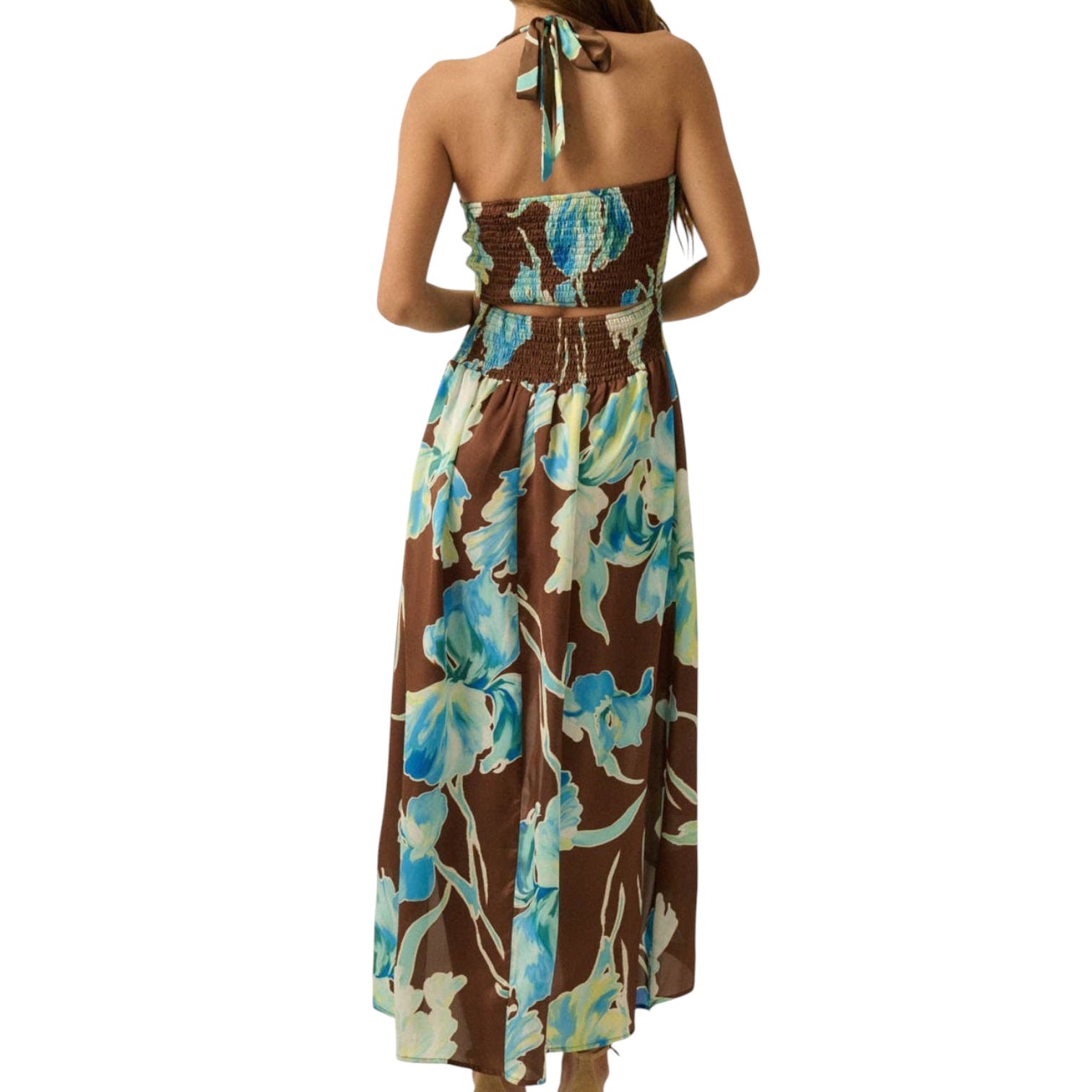 Woman wearing a floral dress with a brown background