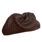 Brown woven handbag on a white background