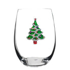 Clear glass wine glass with a decorative Christmas tree charm on a white background