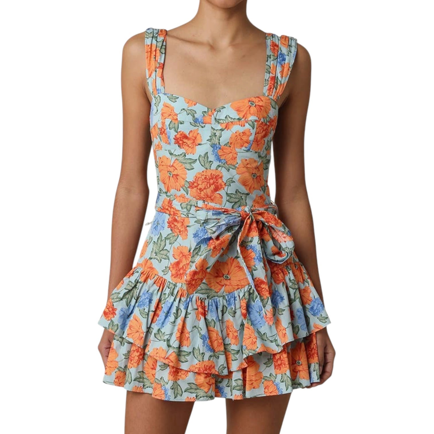 Woman wearing a floral dress with orange and blue flowers on a white background