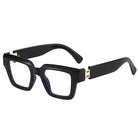 Black rectangular eyeglasses with gold accents on a white background