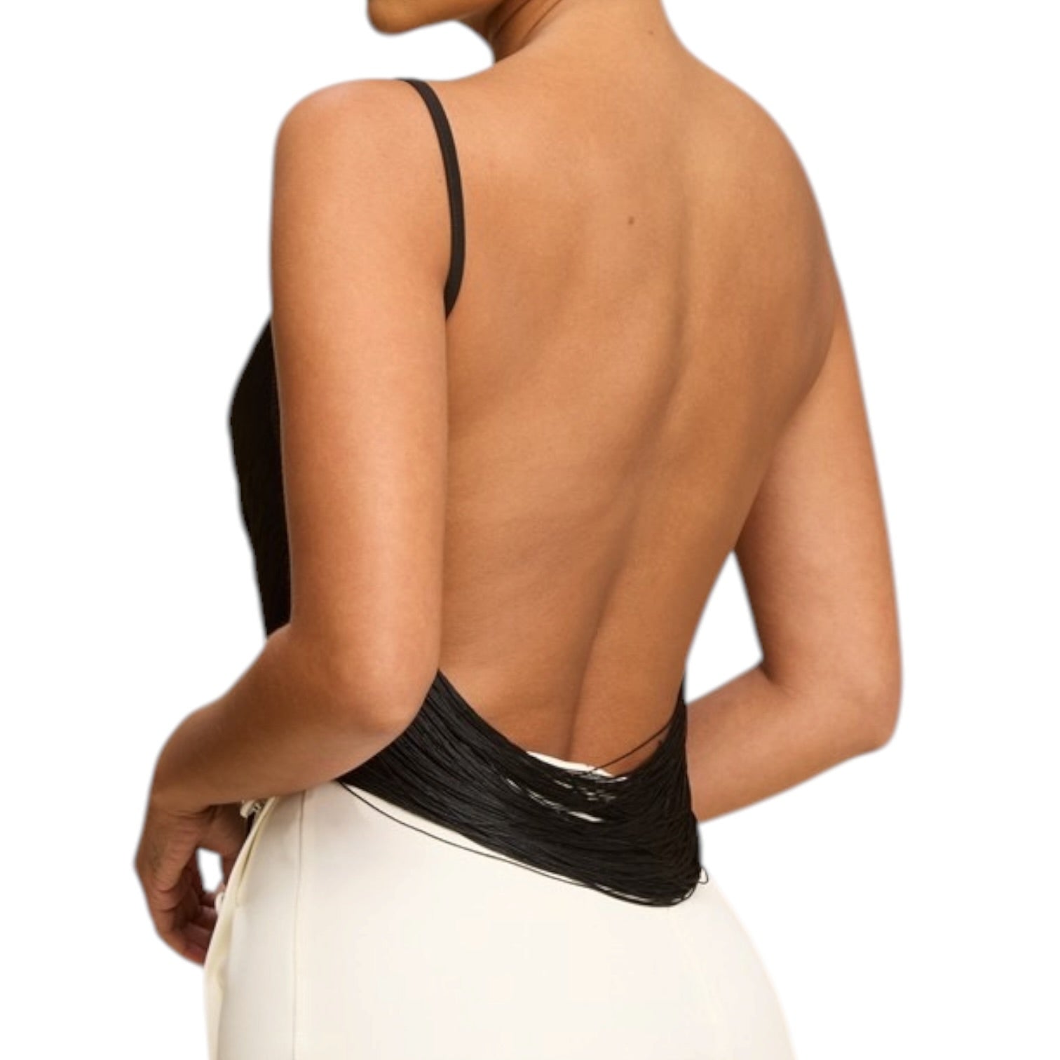 Black open-back top worn by a person on a white background