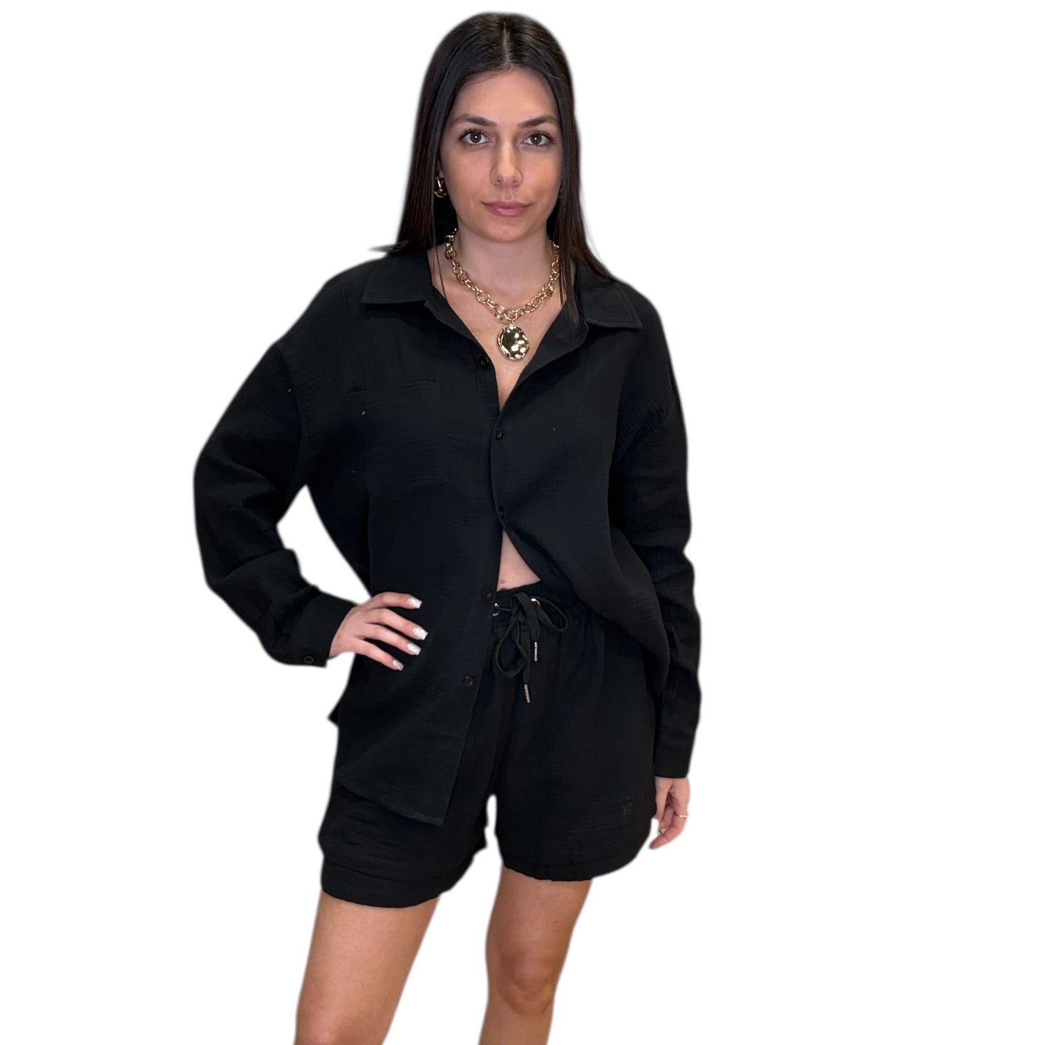 Woman wearing a black outfit on a white background