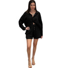 Woman wearing a black outfit on a white background