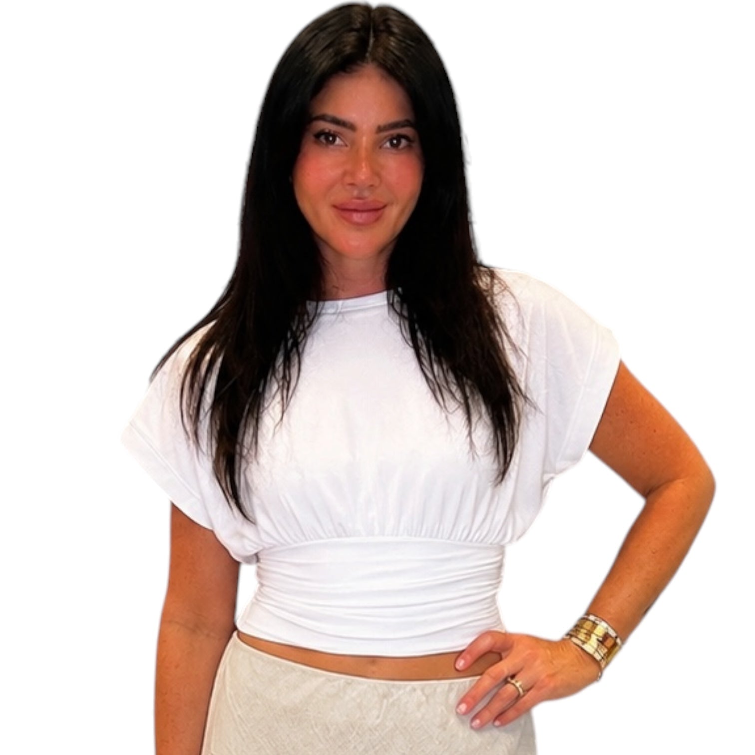 Woman wearing a white top and beige skirt on a white background
