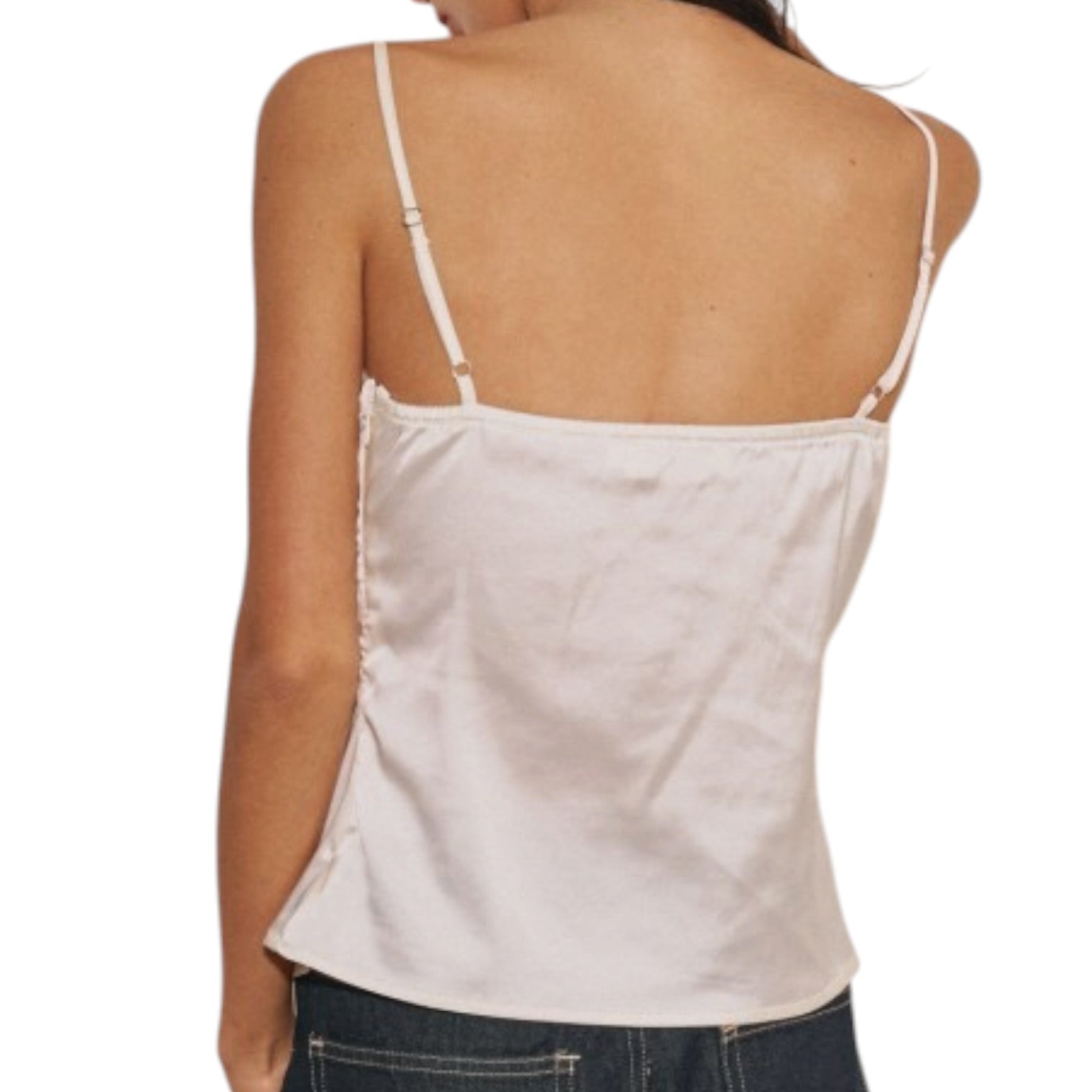 Woman wearing a cream tank top on a white background