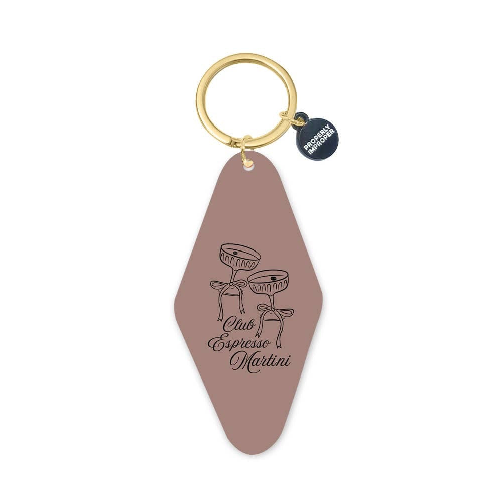 Keychain with a pink tag featuring espresso martini design and gold ring on a white background