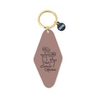 Keychain with a pink tag featuring espresso martini design and gold ring on a white background