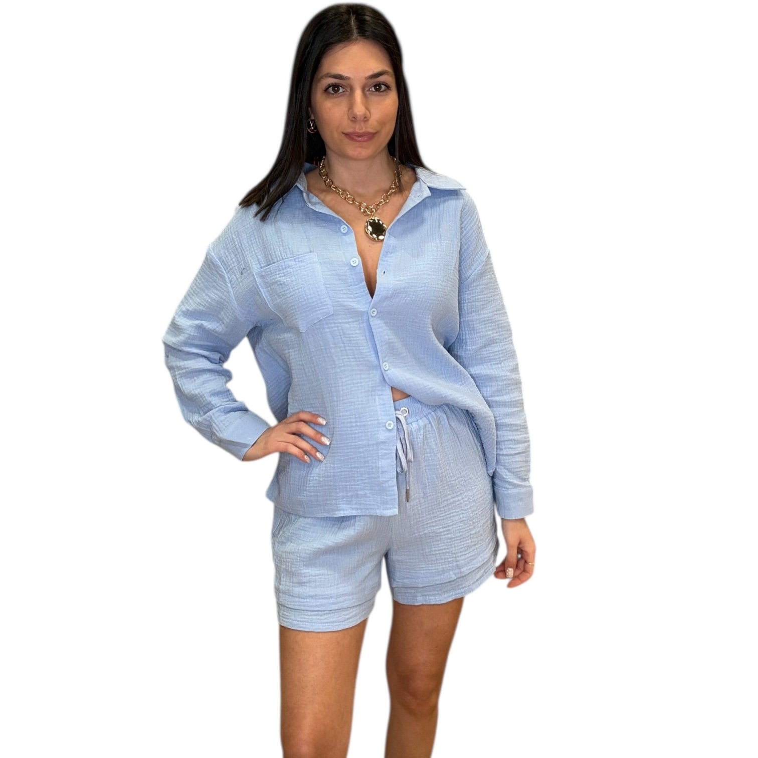 Woman wearing a light blue striped shirt and shorts set on a white background