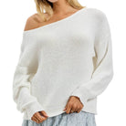 White off-shoulder sweater worn by a person on a white background