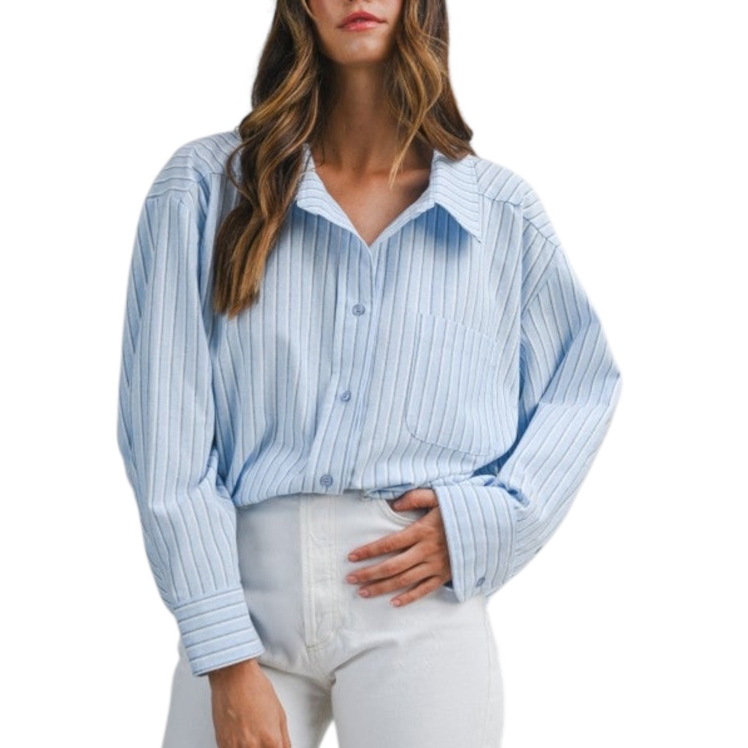 Woman wearing a light blue striped shirt and white pants on a white background