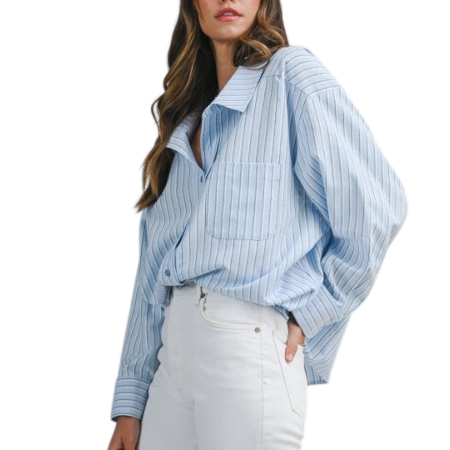 Woman wearing a blue striped shirt and white pants on a white background