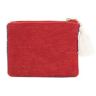 Red fabric pouch with a tassel on a white background