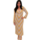 Woman wearing a patterned dress on a white background