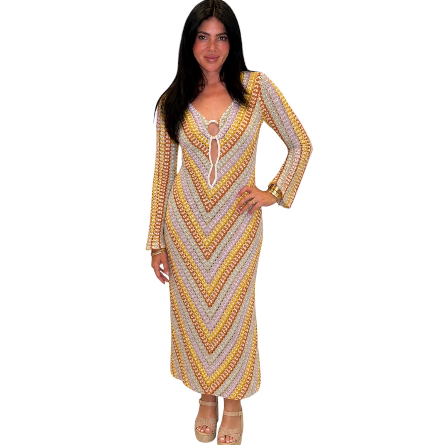 Woman wearing a patterned dress on a white background