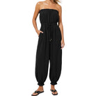 Black strapless jumpsuit worn by a model on a white background