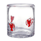Clear glass tumbler with red lobster designs on a white background