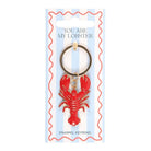 Red lobster keychain on a blue card with text