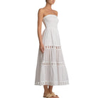 White strapless dress with lace details on a white background