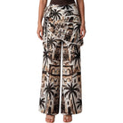 Wide-leg pants with a palm tree and building pattern on a white background
