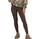 A model wearing dark brown full-length leggings, a camouflage print sweatshirt, and brown slip-on shoes against a plain white background.