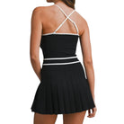Black dress with white straps on a white background