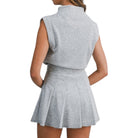 Gray sleeveless top and pleated skirt set on a white background