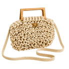 Beige woven handbag with wooden handle on a white background