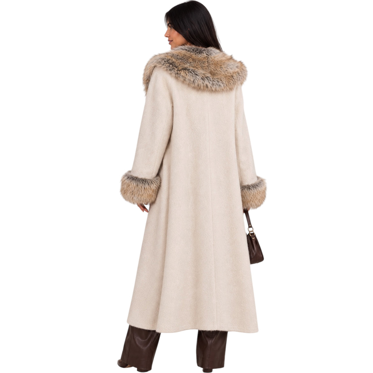 A woman shown from the back wearing a long cream-colored coat with a large brown and beige faux-fur collar and matching faux-fur trimmed cuffs, paired with dark brown pants and holding a small brown handbag against a plain white background.