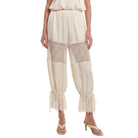Beige pants with lace detailing on a white background