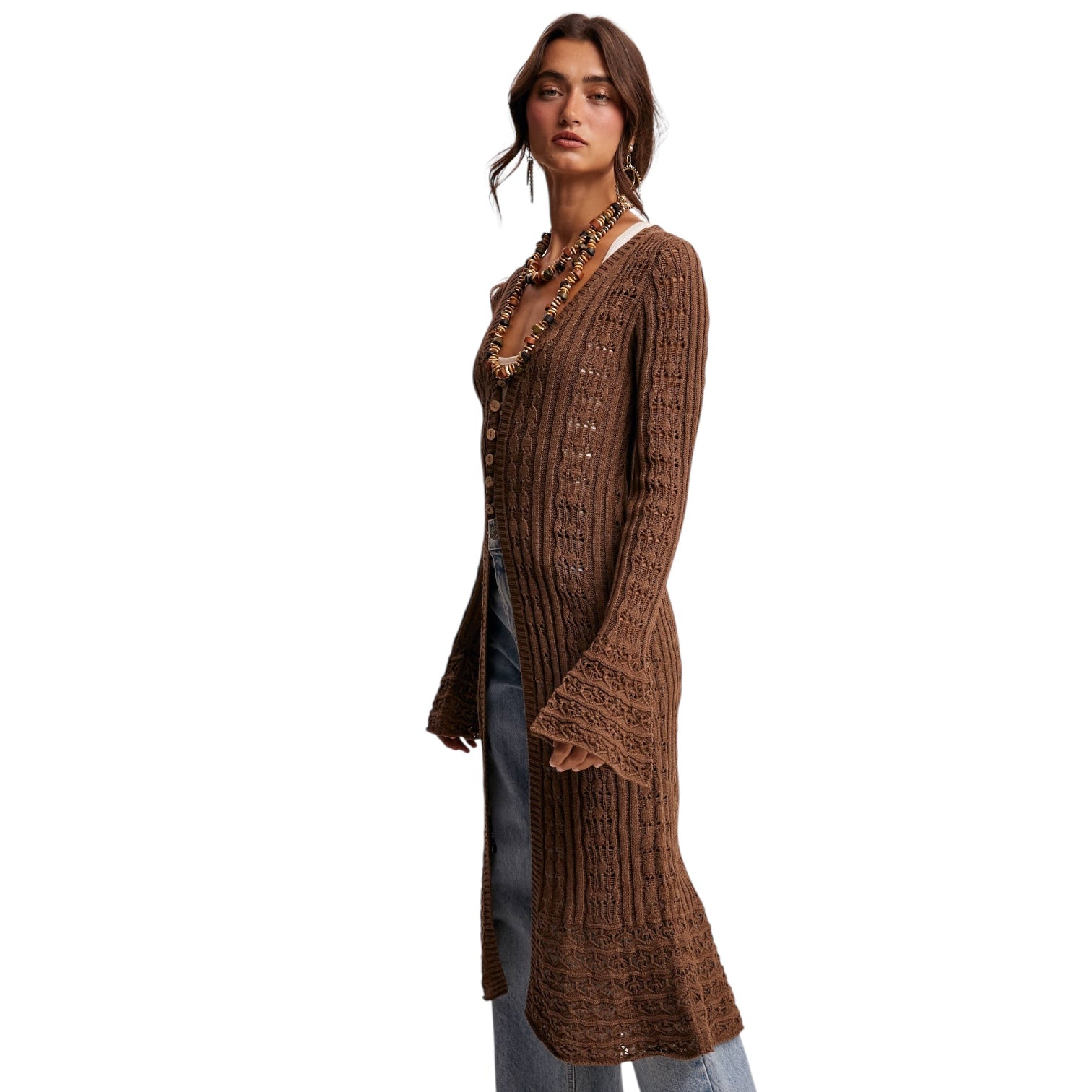 Woman wearing a brown ribbed cardigan on a white background