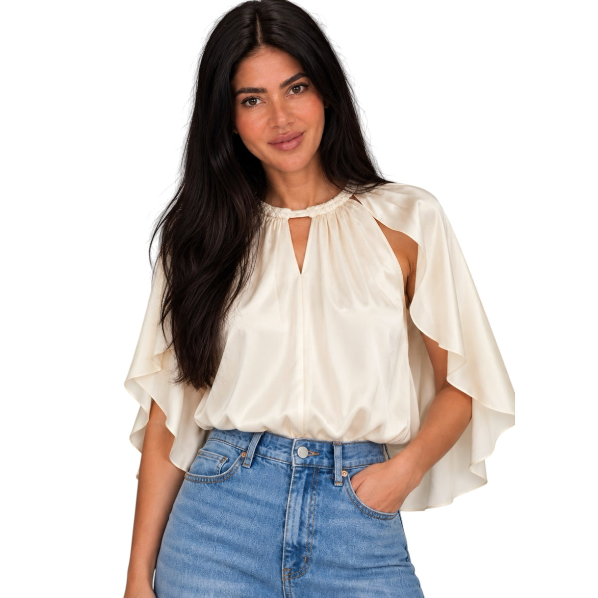 A woman modeling a cream satin blouse with flutter sleeves and a keyhole cutout neckline, paired with blue jeans, against a plain white background.