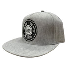 Gray cap with a black and white patch on a white background