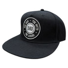 Black cap with 'DAD' text on a white background