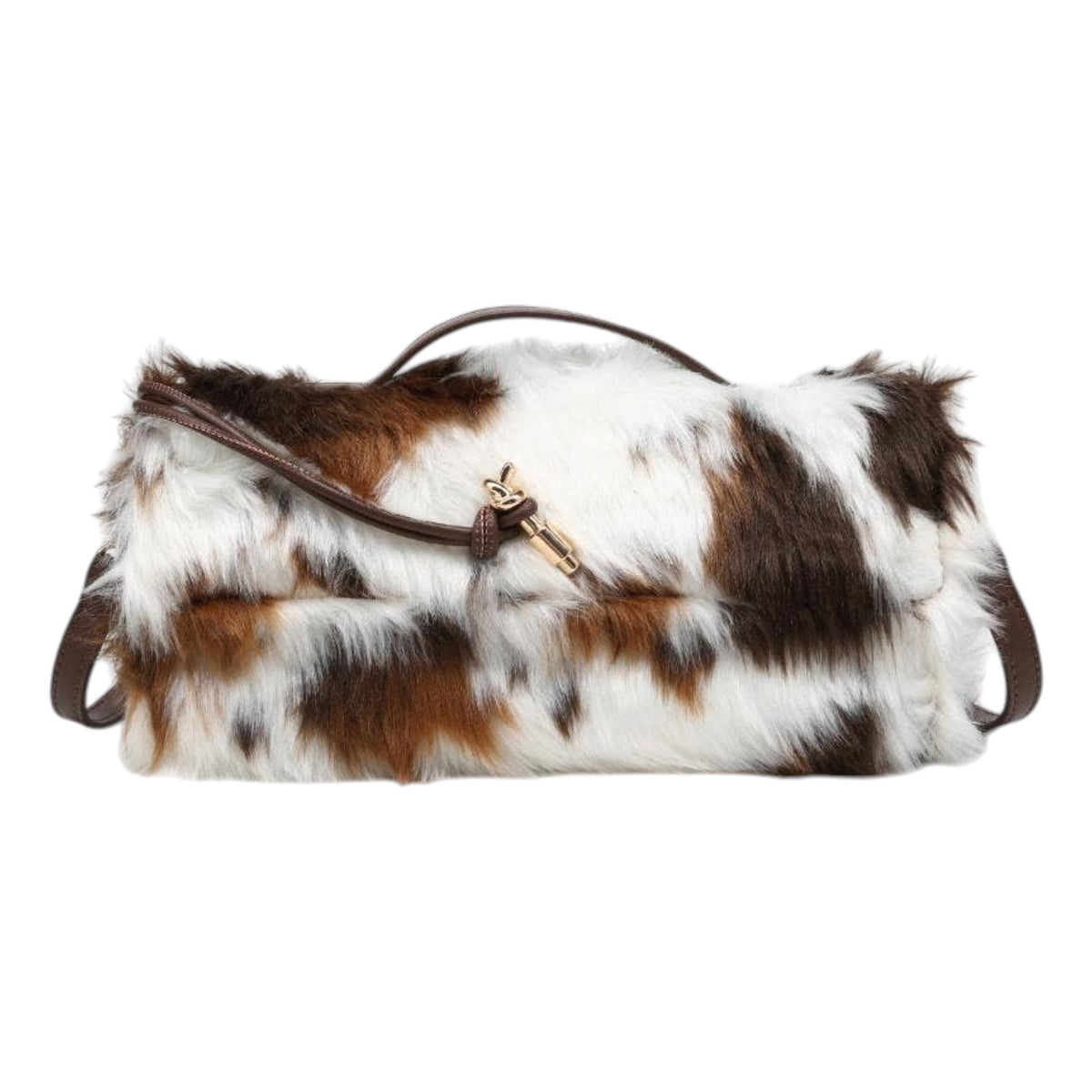 A cowhide shoulder bag with brown and white patches, featuring a dark brown leather handle and strap with a gold-tone clasp.