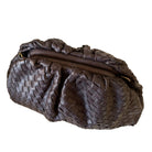 Brown woven handbag on a white background