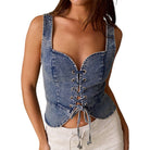 woman wearing denim lace-up corset top on white background