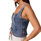 woman wearing denim lace-up corset top on white background
