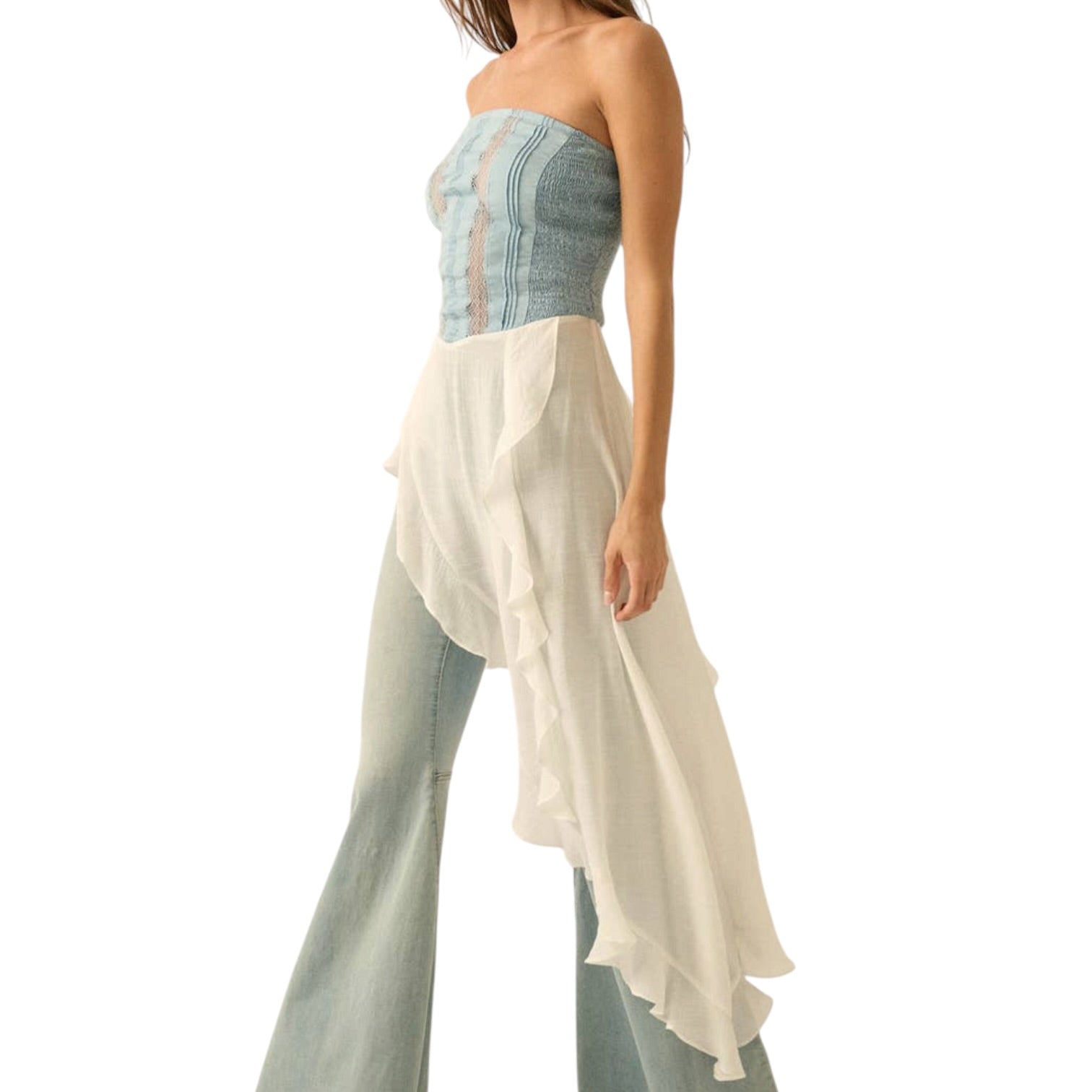 Woman wearing a strapless top and long skirt with a white background