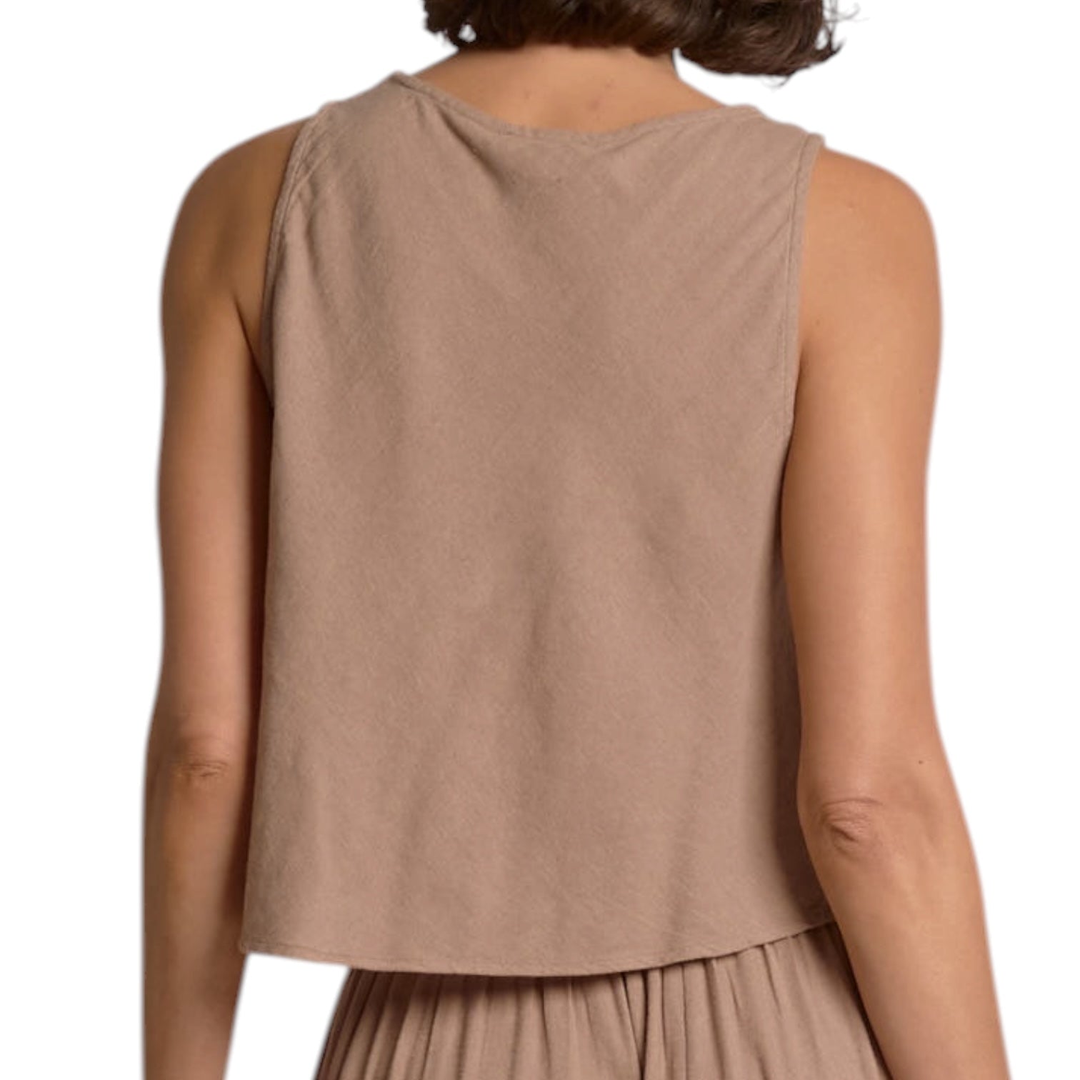 Brown sleeveless top worn by a person on a white background